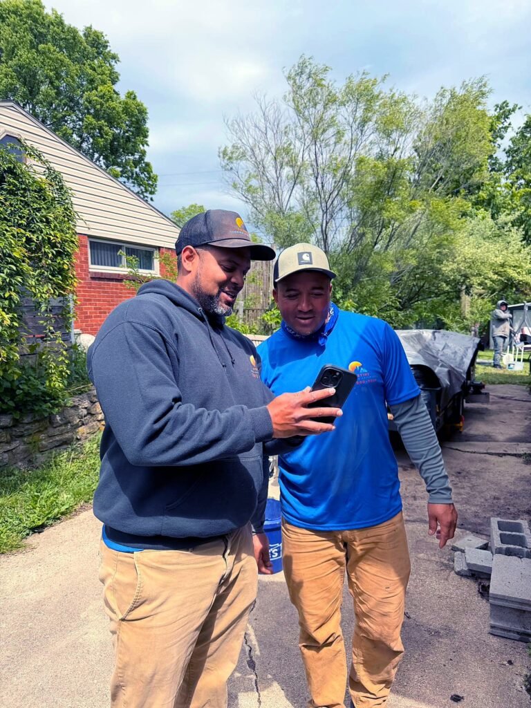Pristine Roofing & Exteriors crew reviewing a project